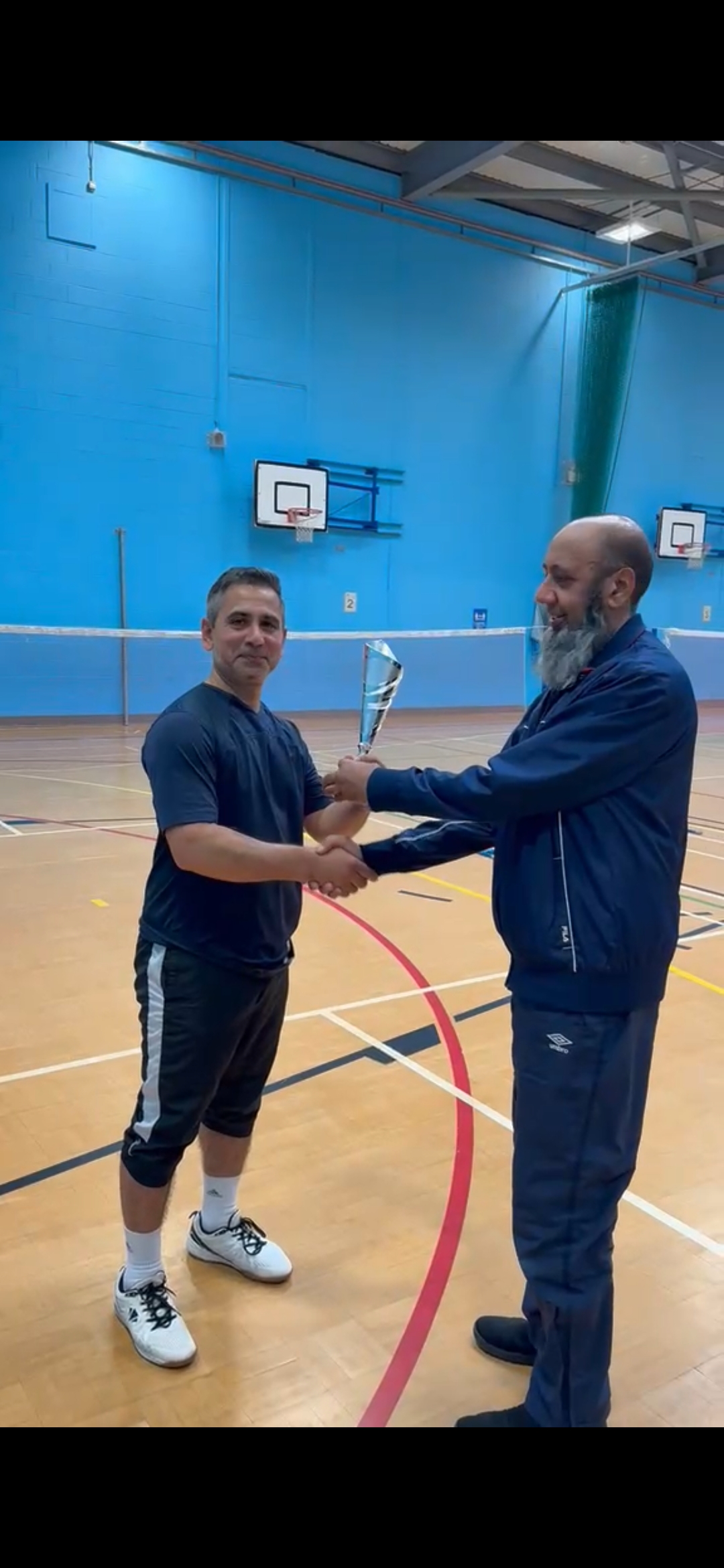 Parvez Bhai handing trophy for runners-up to Jalal